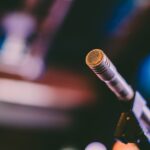 Detailed shot of a microphone with artistic bokeh background, ideal for concerts.